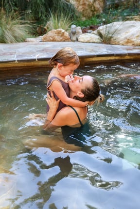 A mother and daughter bathing in hot springs