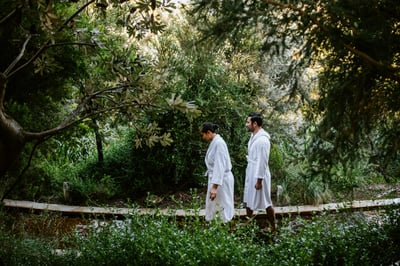 1666229422-bath-house-reflexology-walk-couple-walking-along-3-1