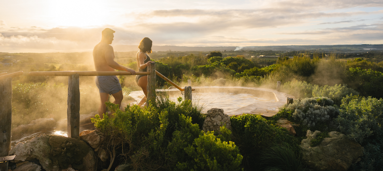 Two people walking into the Hilltop Pool