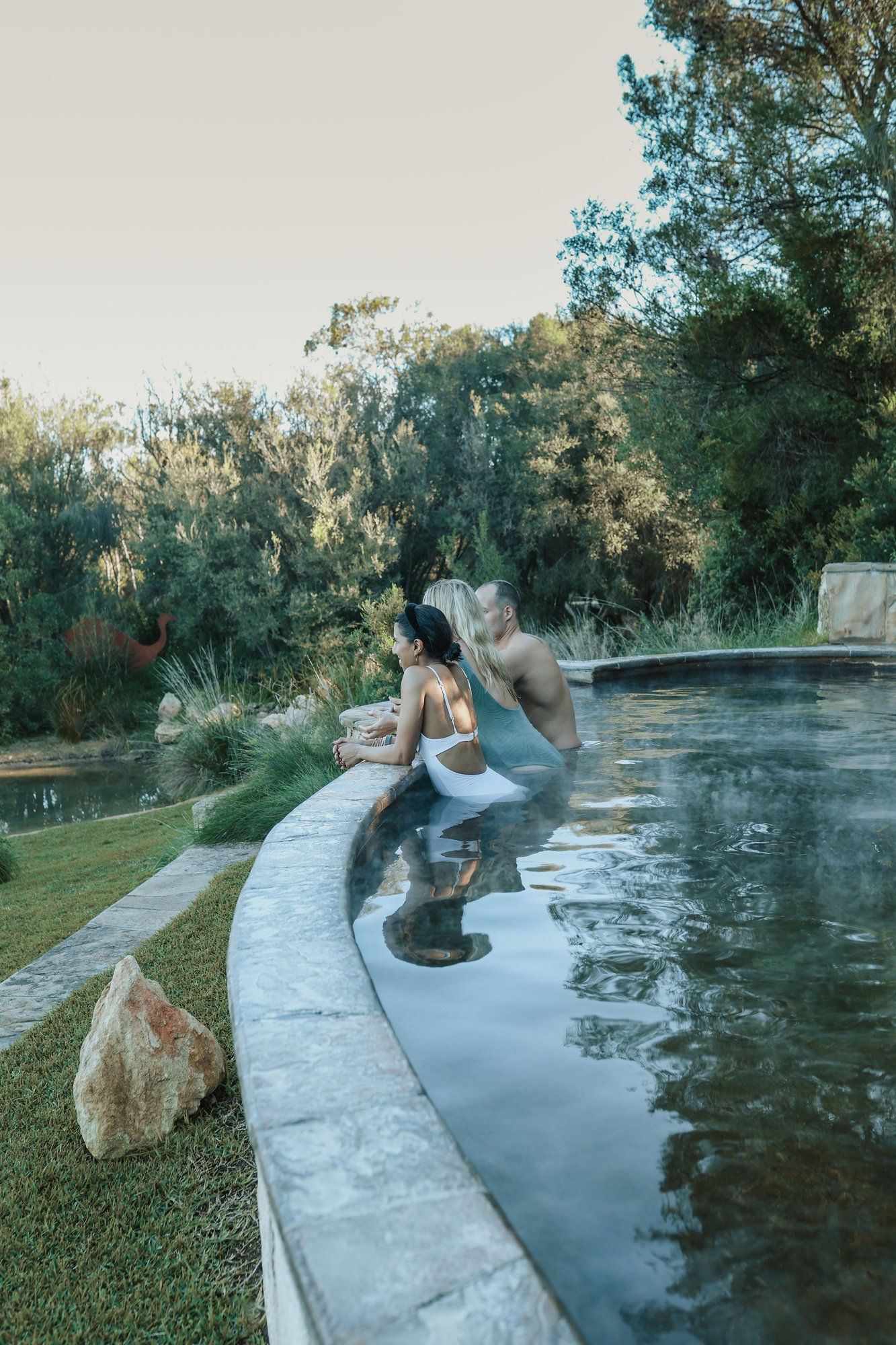 Three people bathing in the Amphitheatre