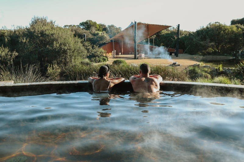 Two people bathing in hot springs