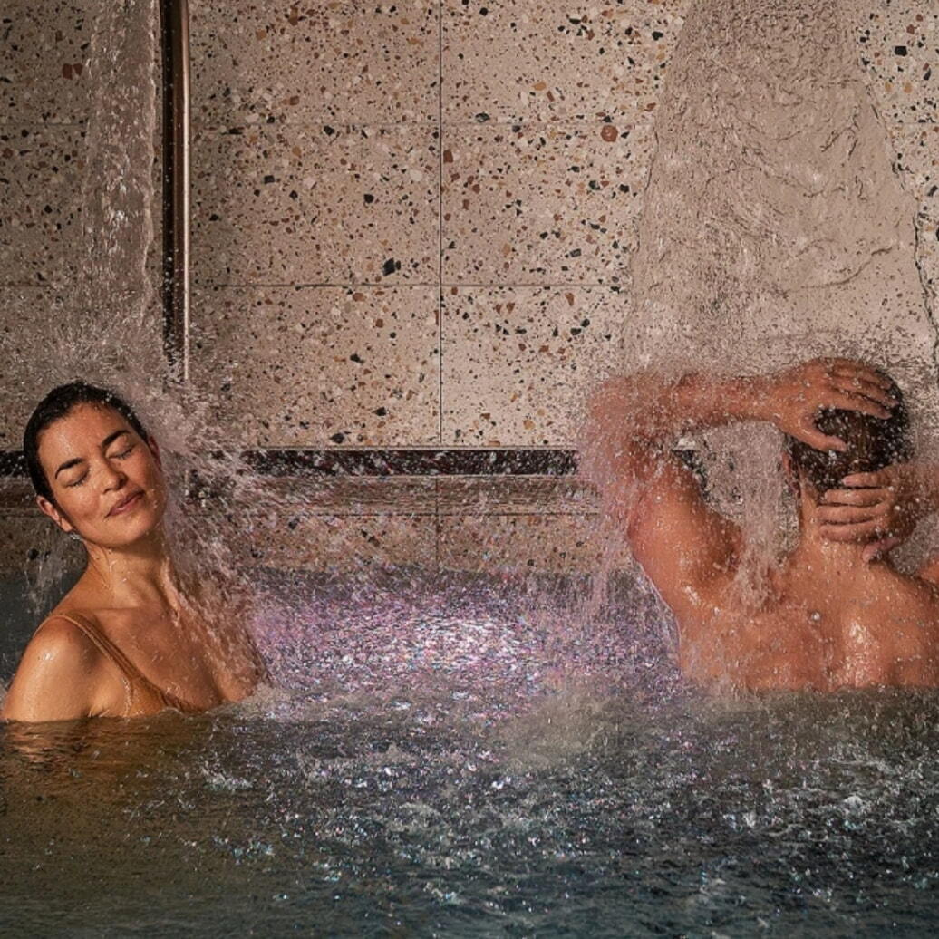 Two people bathing at Aurora Spa and Bathhouse