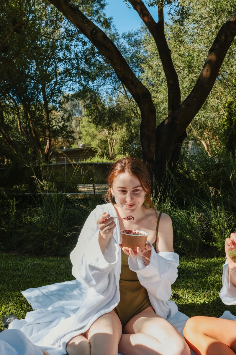 A young girl eating an Acai bowl