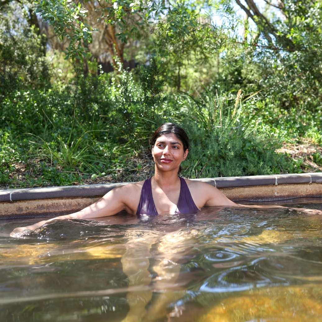 A woman bathing in hot springs