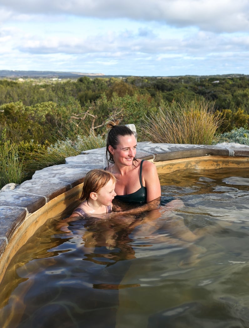 A mother and daughter bathing in hot springs