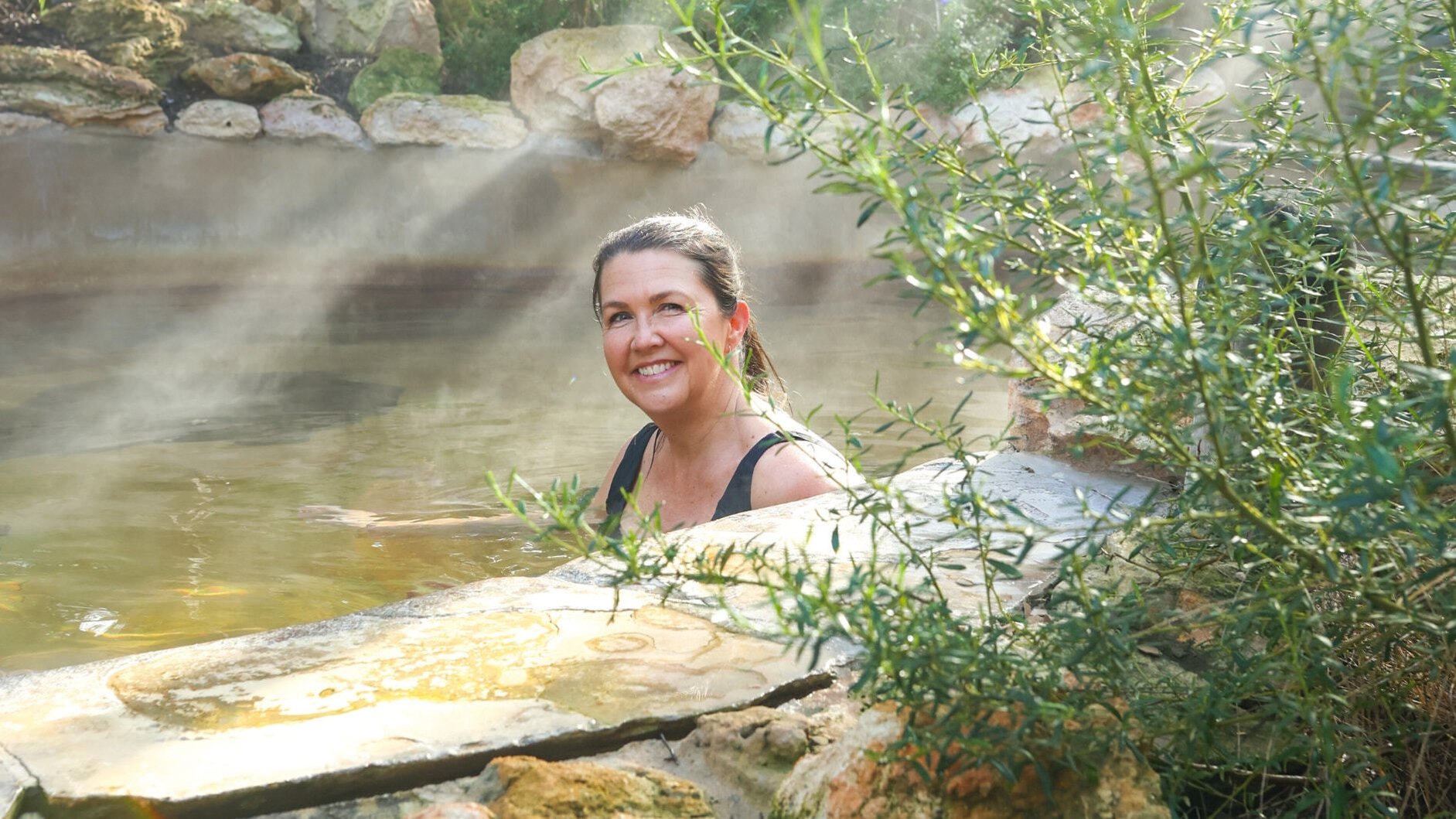 A woman bathing in hot springs