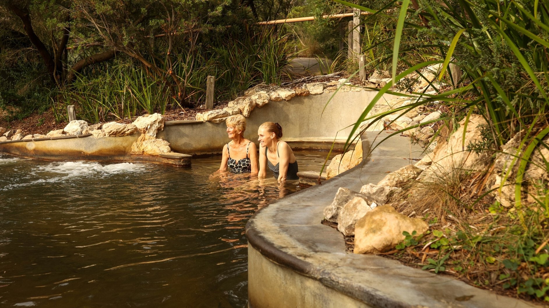 A mother and daughter bathing in hot springs