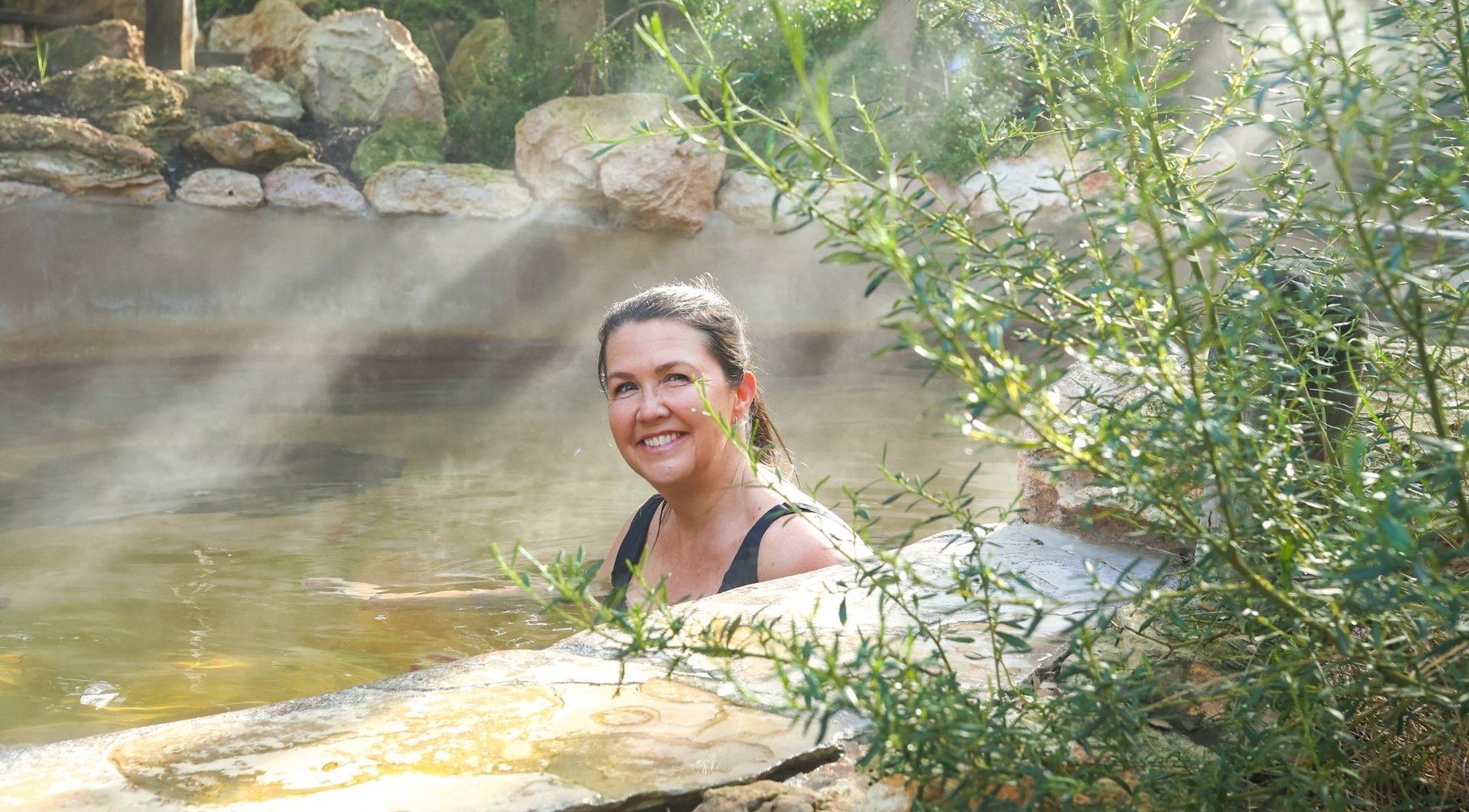 A woman bathing in hot springs