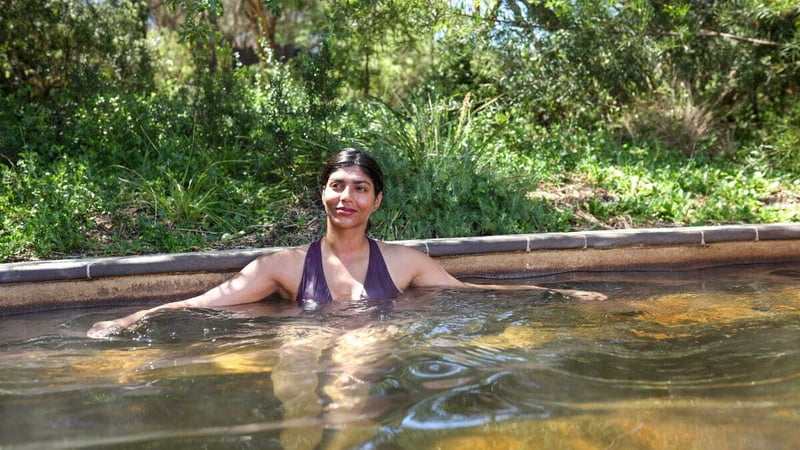 A woman bathing in hot springs