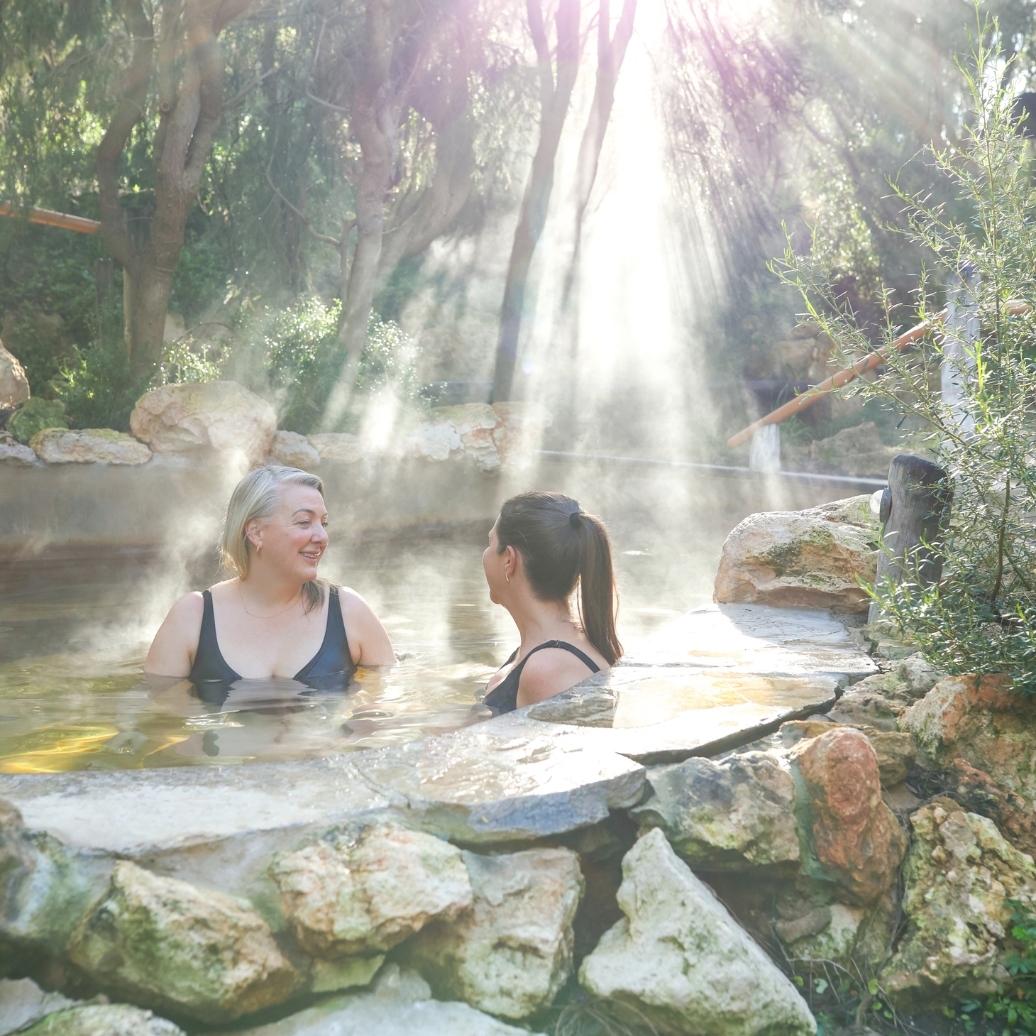 Two people bathing in the Bathing Gully