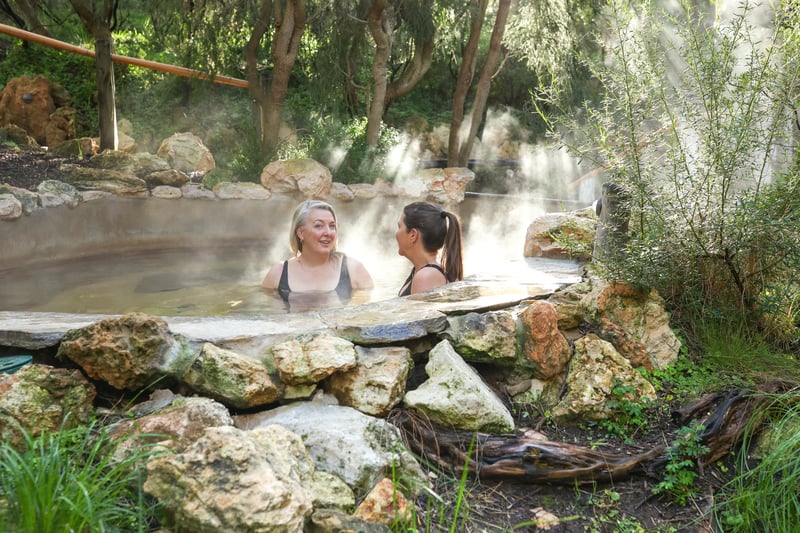 Two women bathing in the Bathing Gully