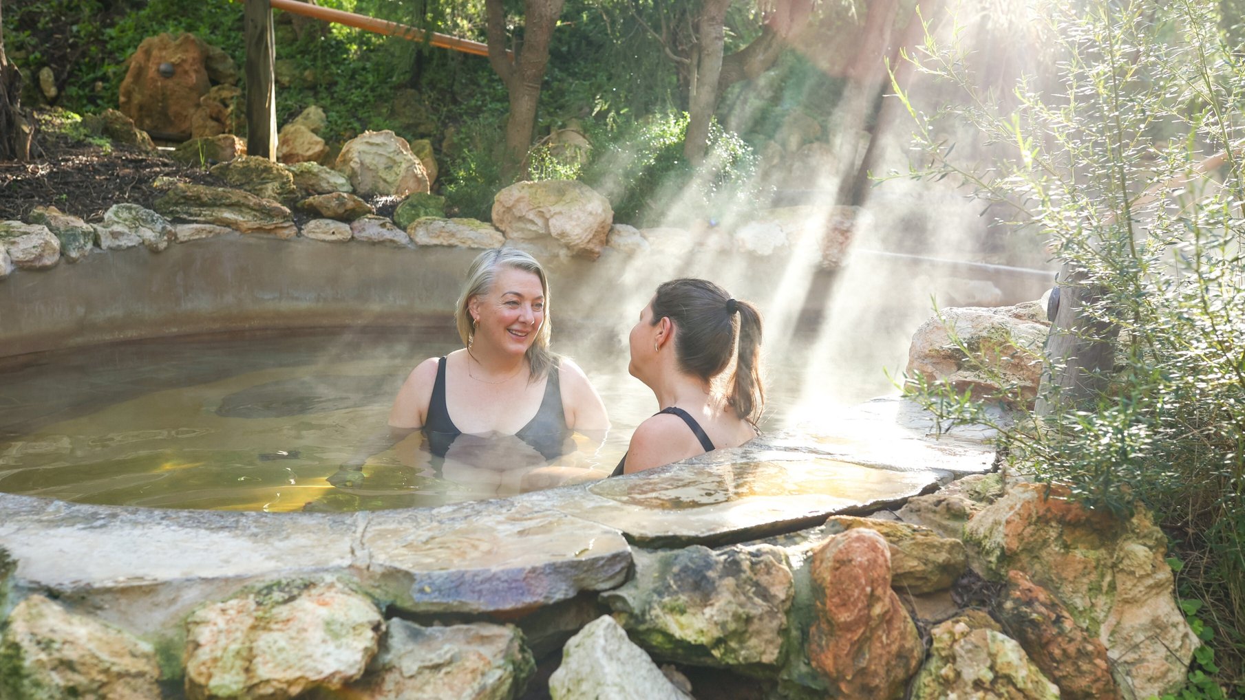 Two women bathing in hot springs