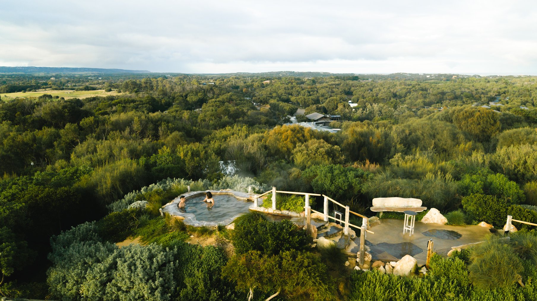 A drone shot of the Hilltop pool in the Bath House