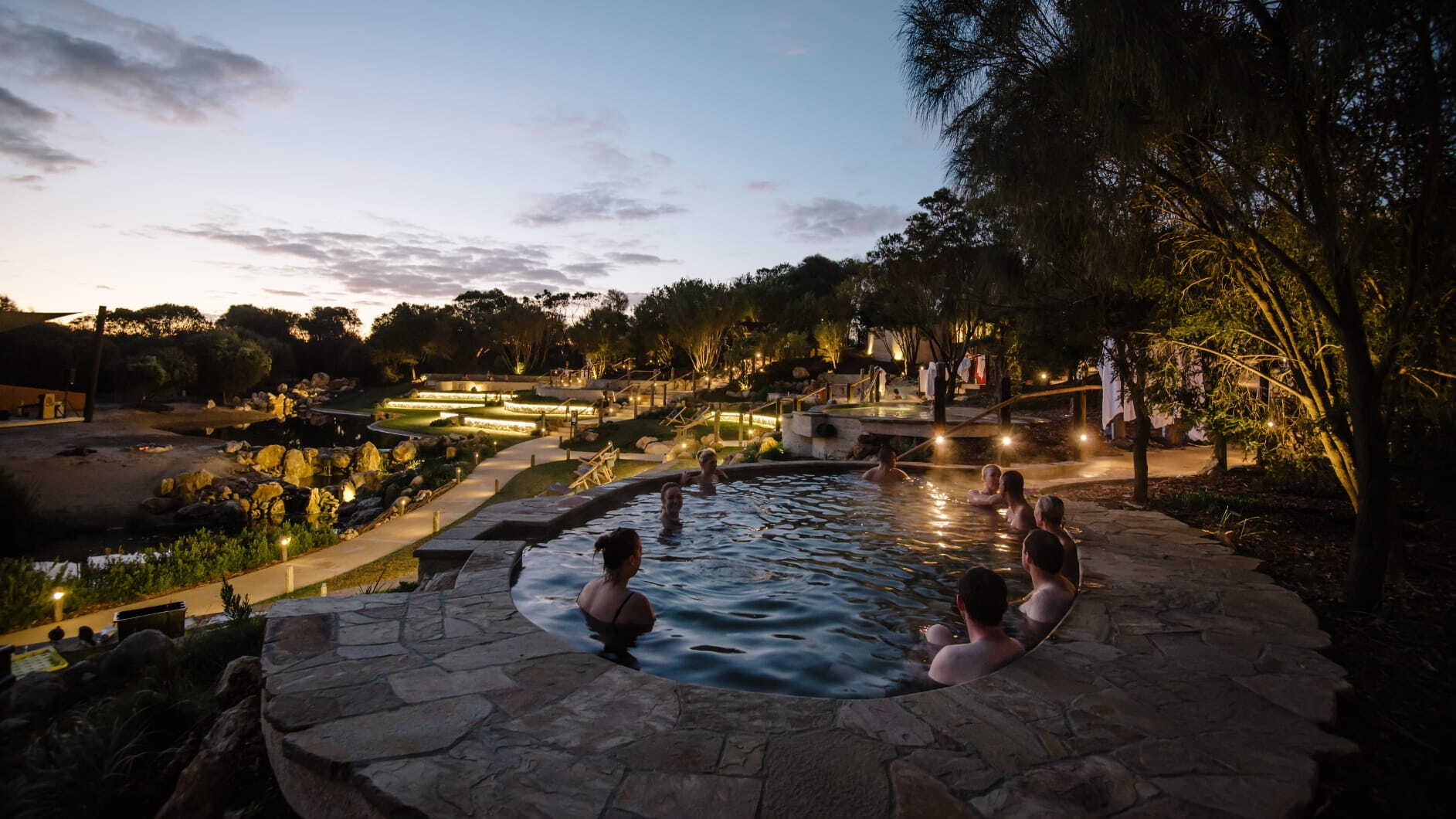 People bathing at twilight