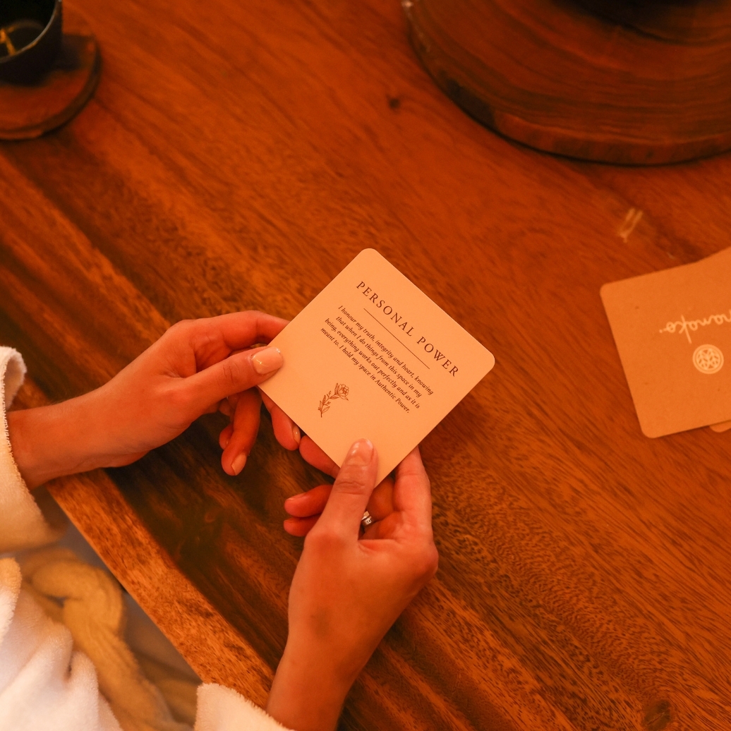 Someone reading an affirmation card