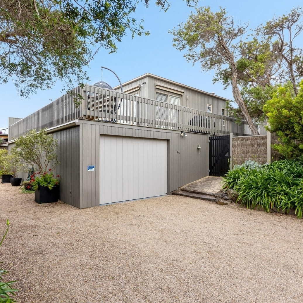 The exterior of a double story beach home
