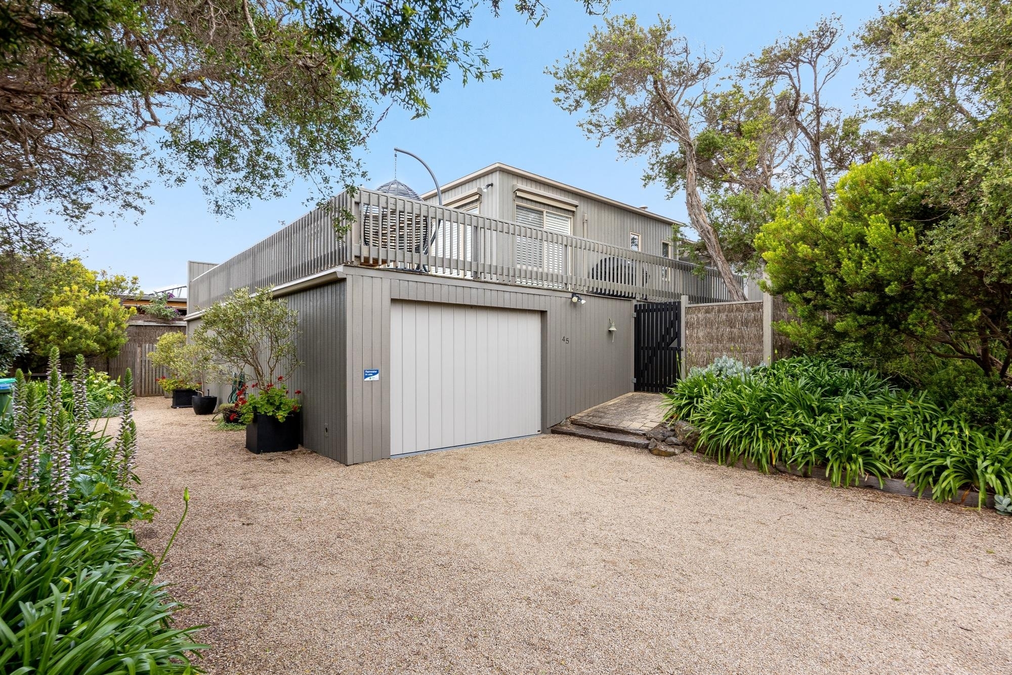 The exterior of a double story beach home