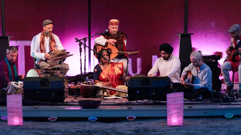 A close up of musicians performing for Diwali on the Amphitheatre stage