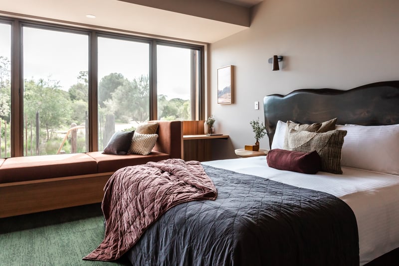 A king-sized bed and day bed in the Eco Lodges