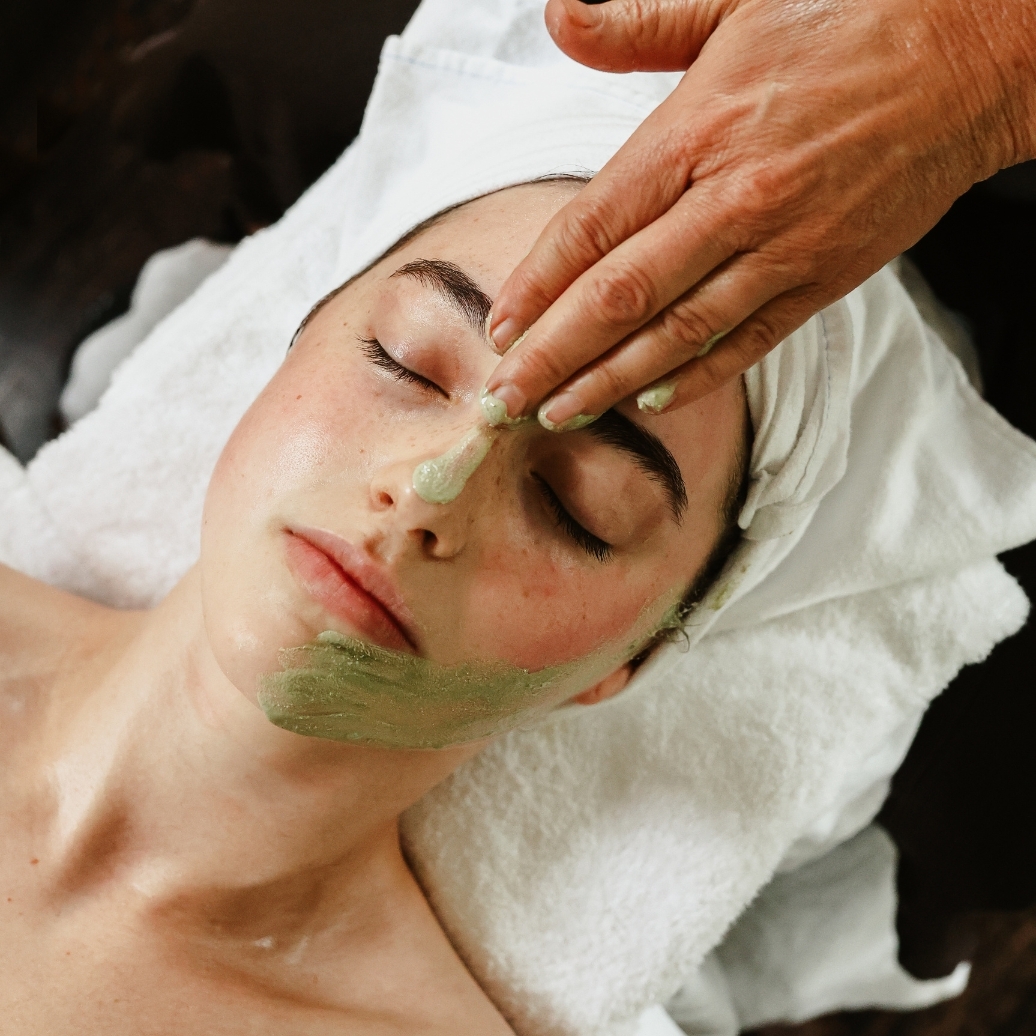 A person receiving a facial