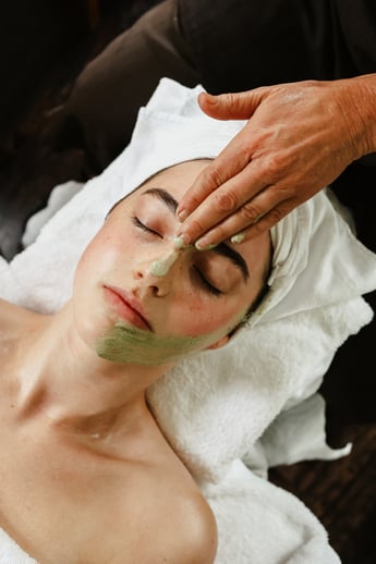 A person receiving a facial