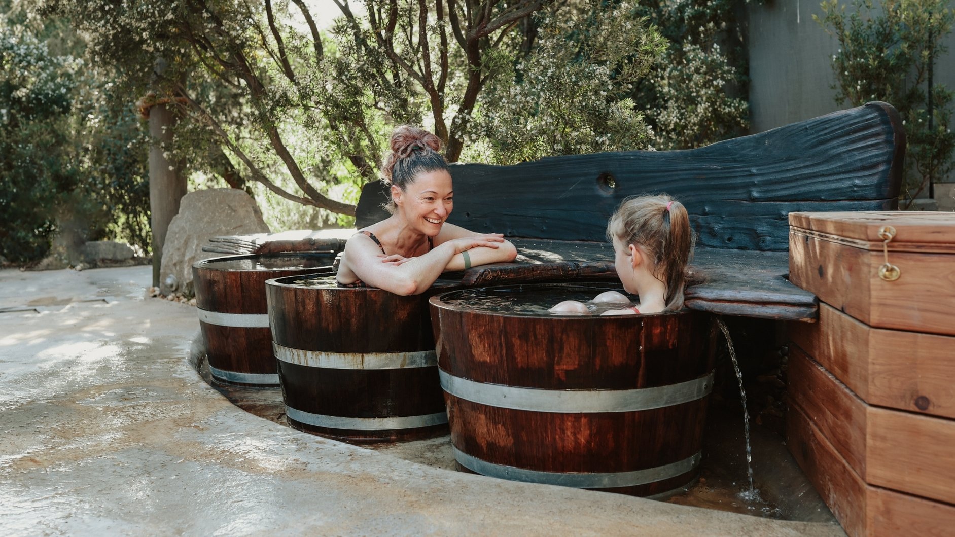 A mother and daughter in the bathing barrels