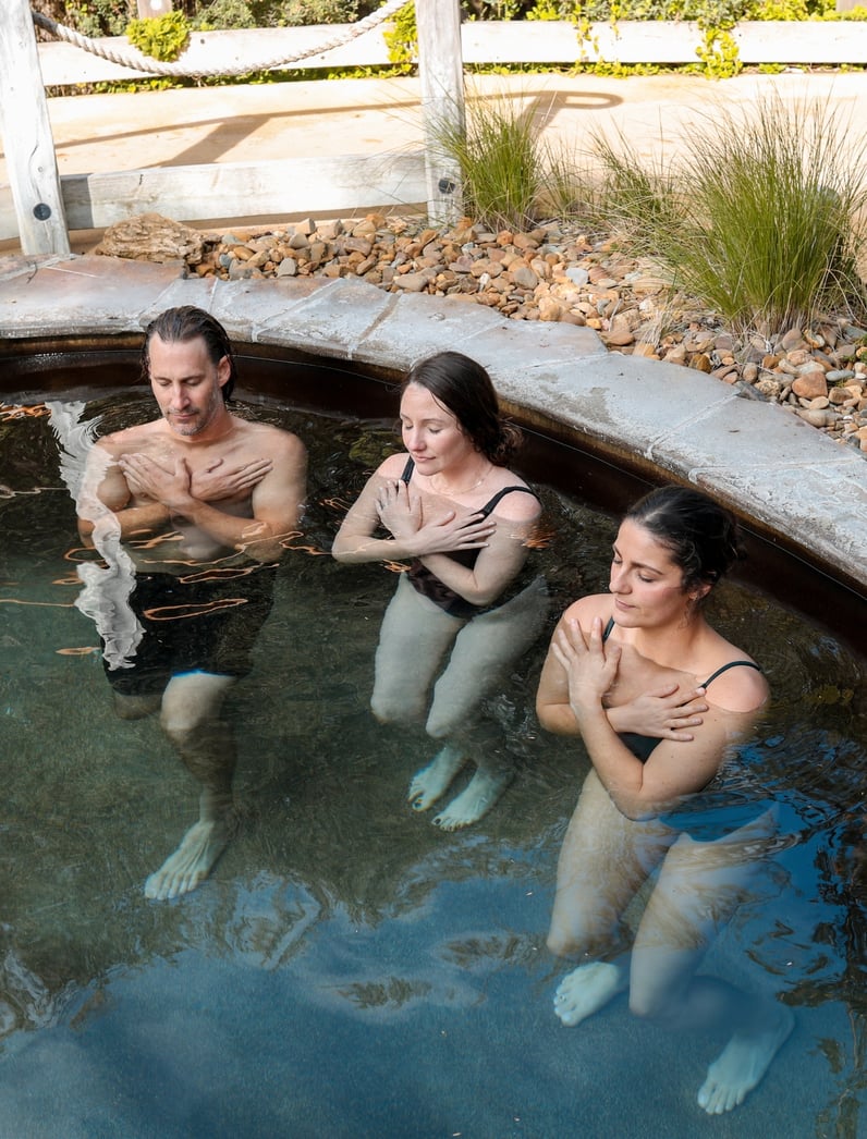 Three people in the cold pool as part of the Fire and Ice workshop