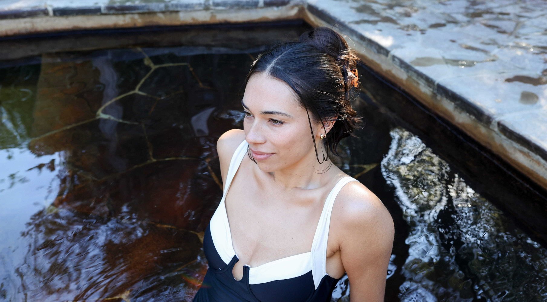A woman bathing in hot springs