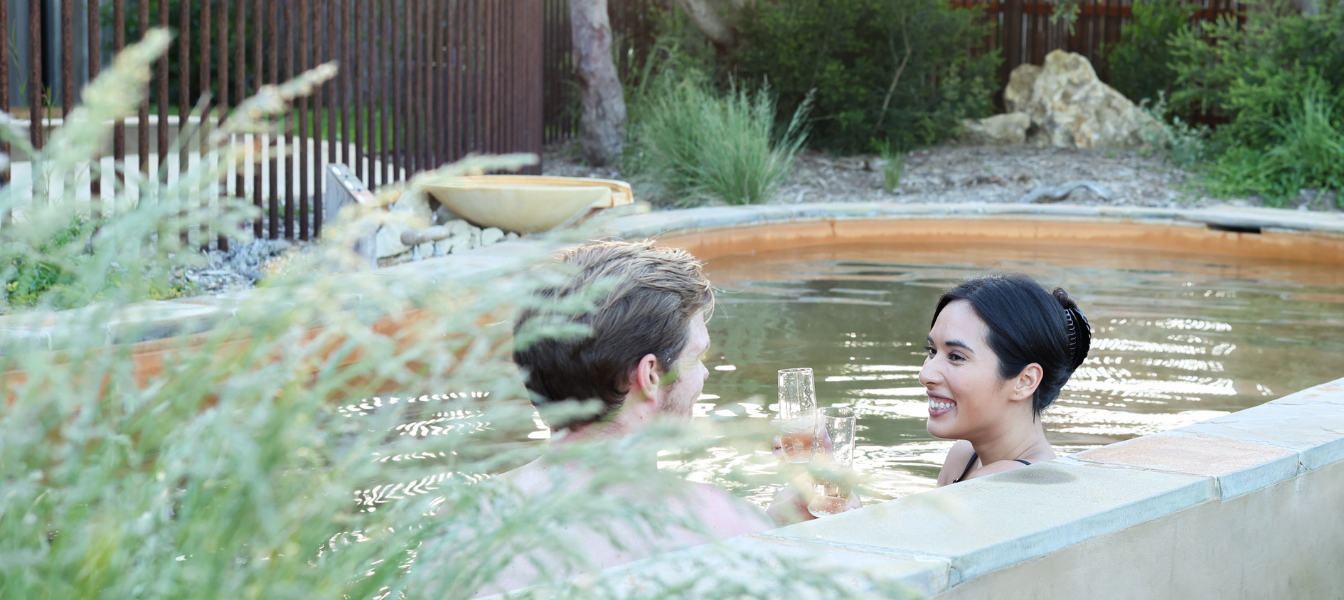 A couple bathing in hot springs