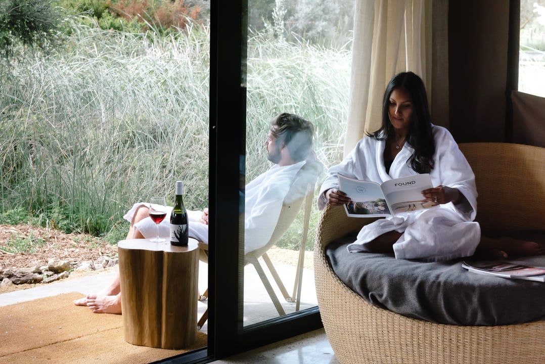 Two people sitting in a Glamping tent