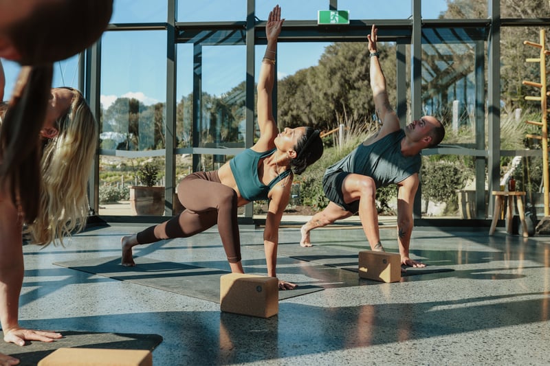 A group of people doing yoga in the Glasshouse