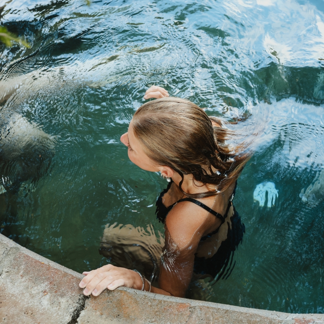 A young woman bathing in hot springs