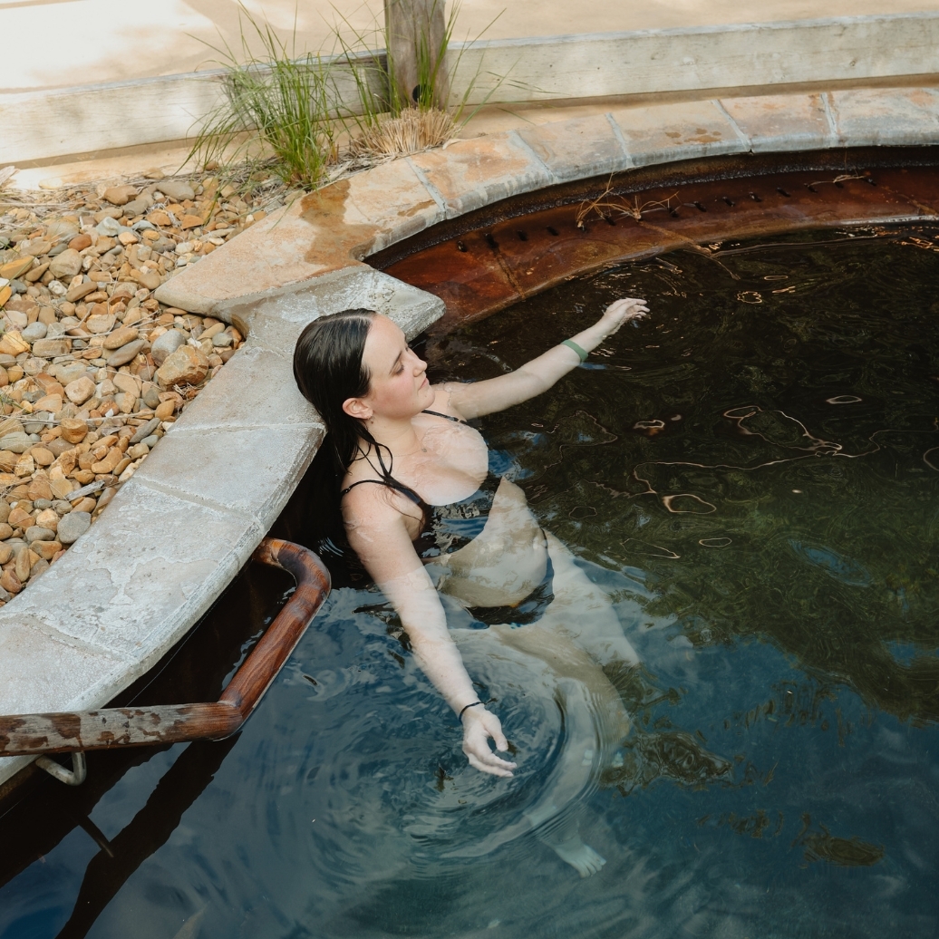 A young woman bathing in the cold pool