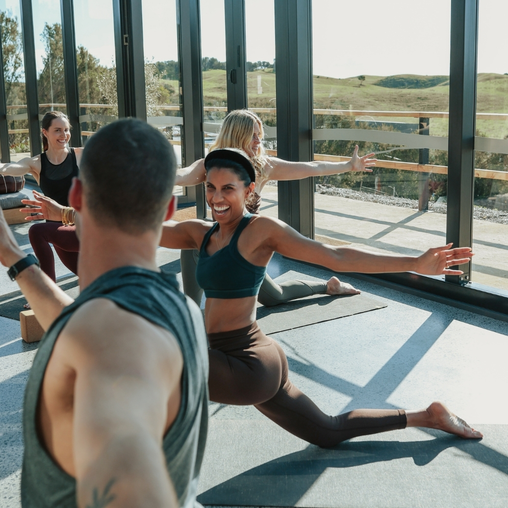 People doing Yoga in the Glasshouse