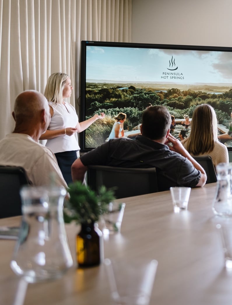 A person in corporate wear doing a presentation