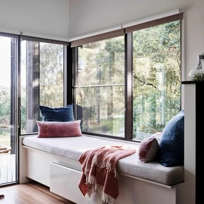 A sun lounge looking out to farm land