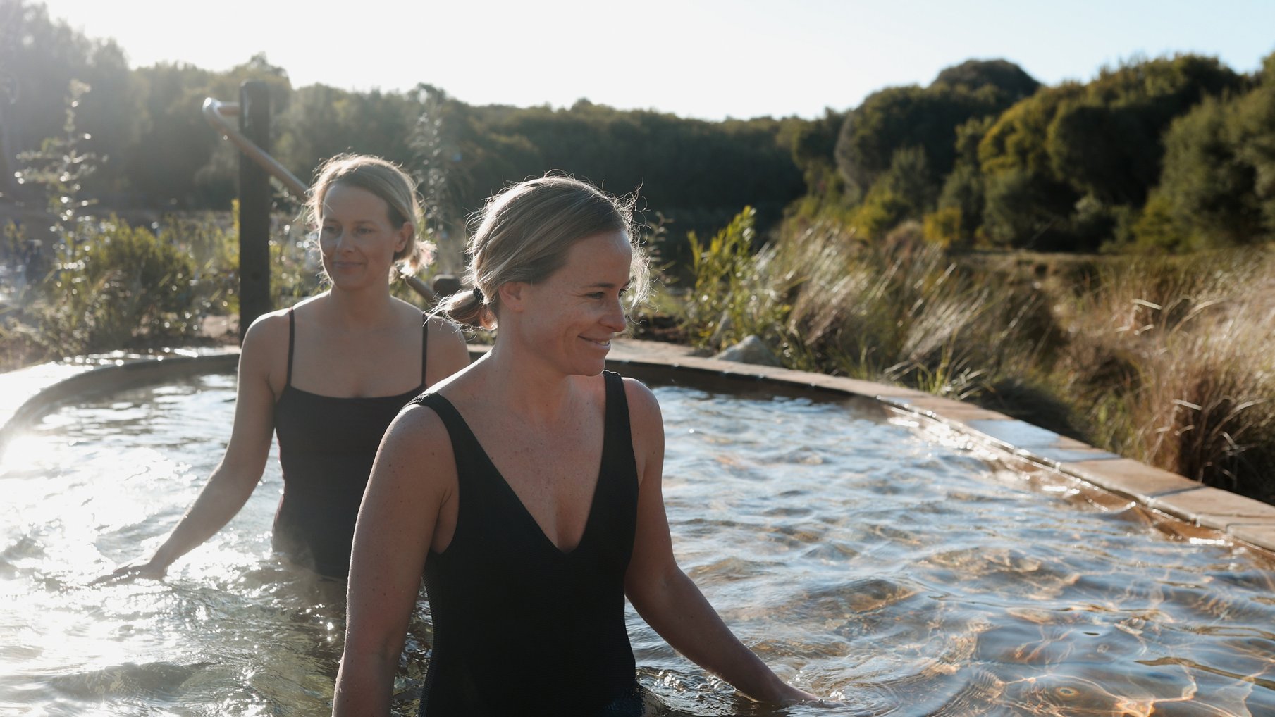 Two friends bathing in hot springs