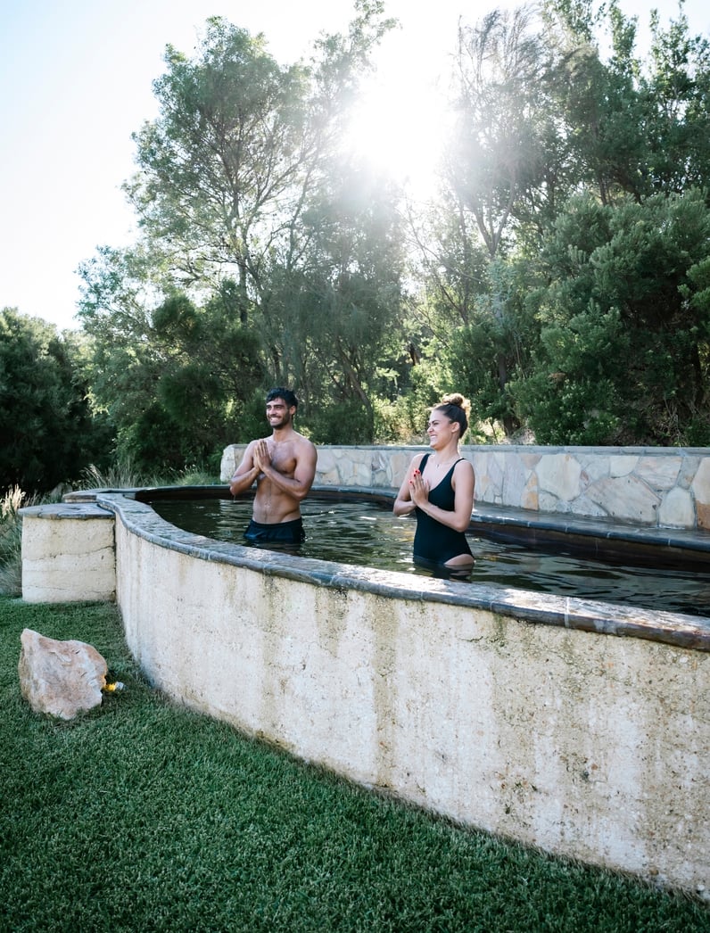 A man and woman doing Hot Springs Yoga
