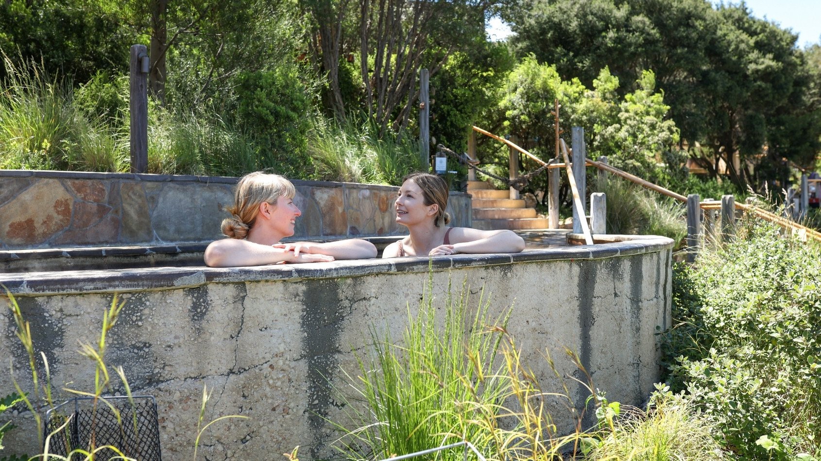 Two friends bathing in hot springs