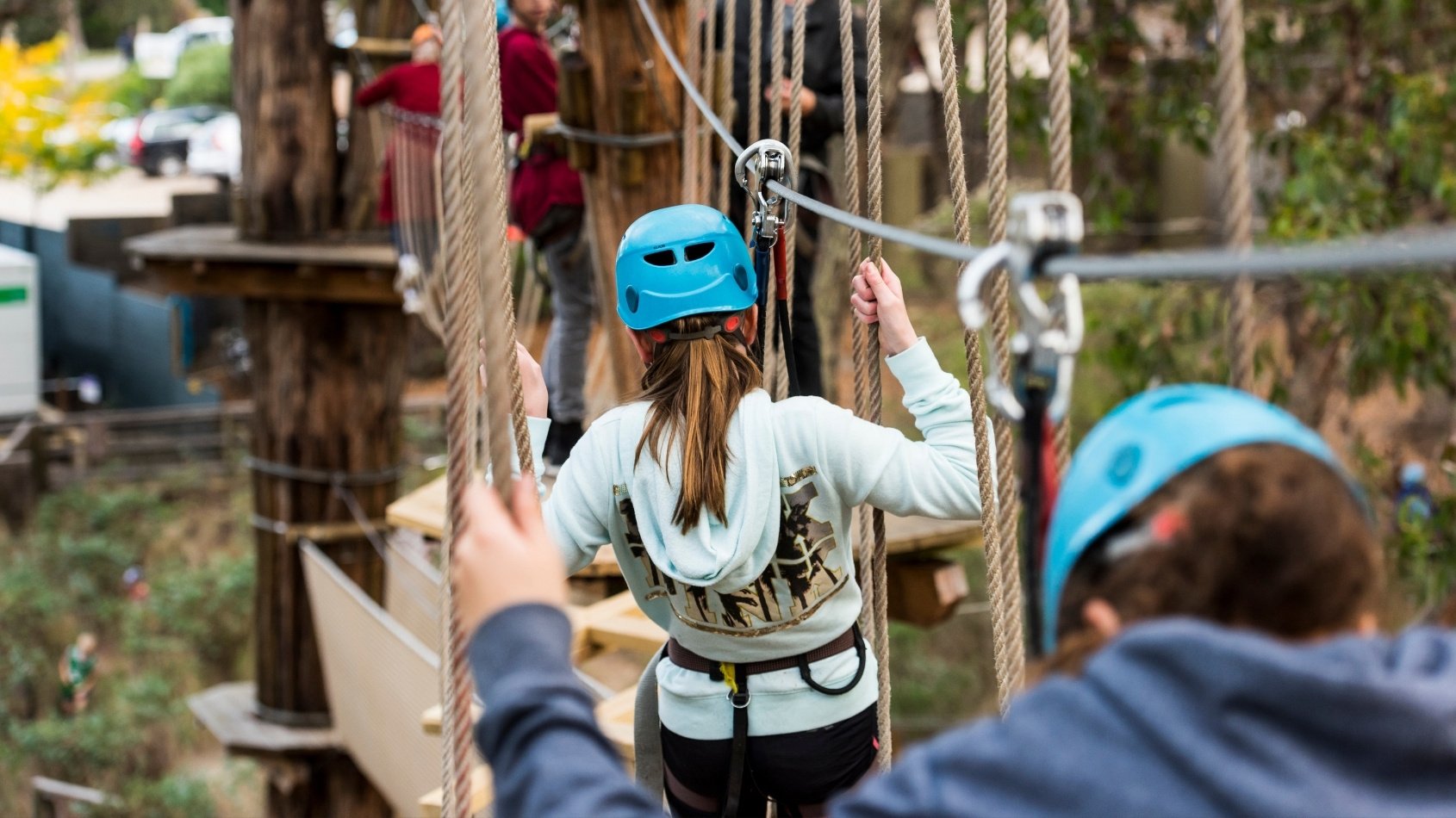 People tree climbing at Enchanted Adventure Garden