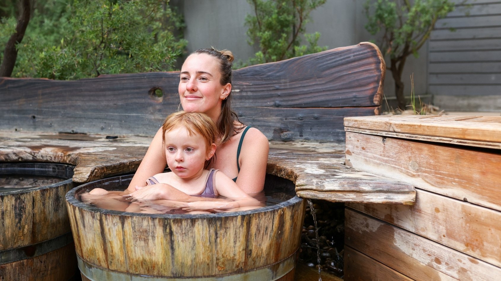 A mother and daughter bathing in hot springs