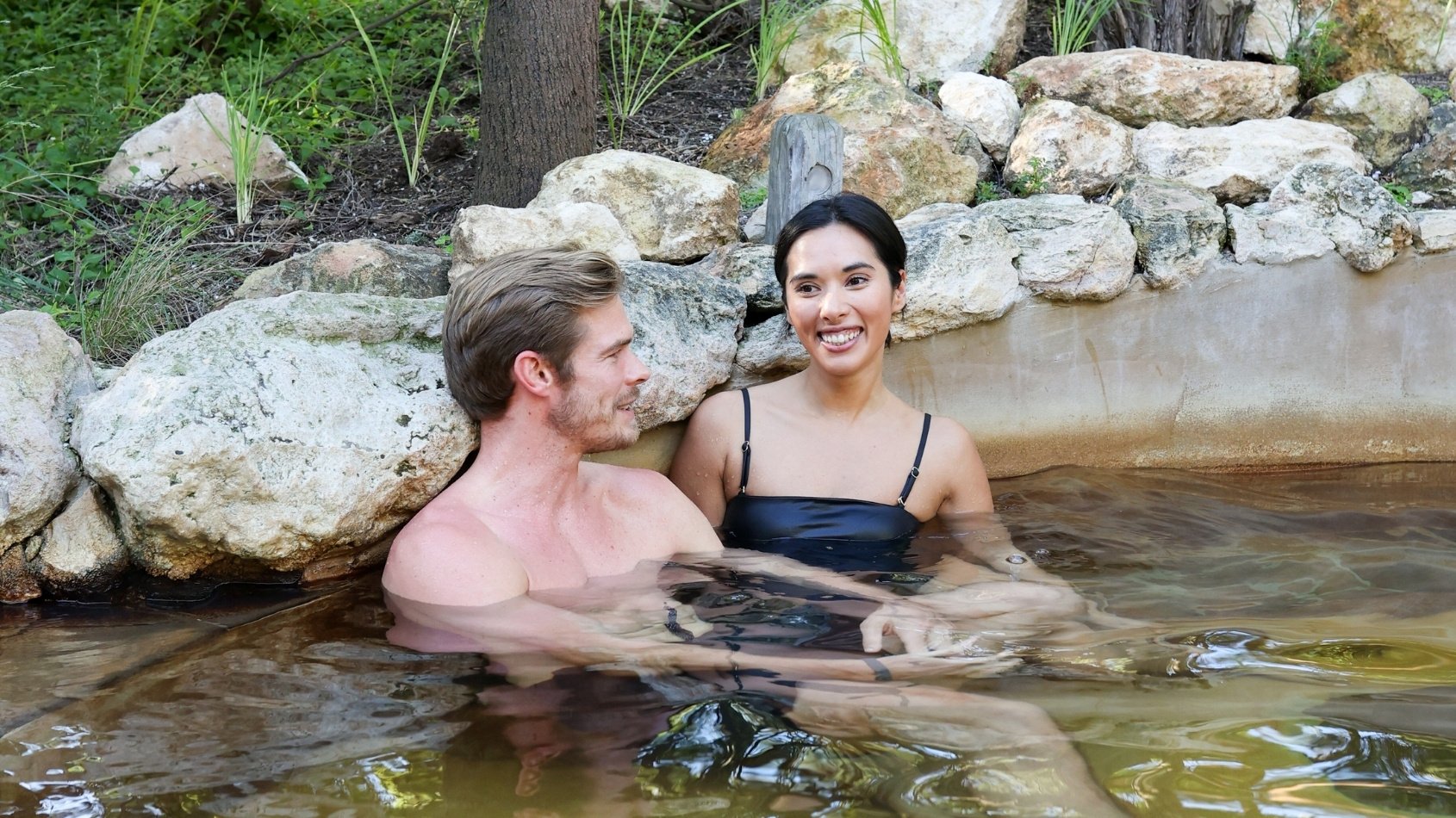 A couple bathing in hot springs
