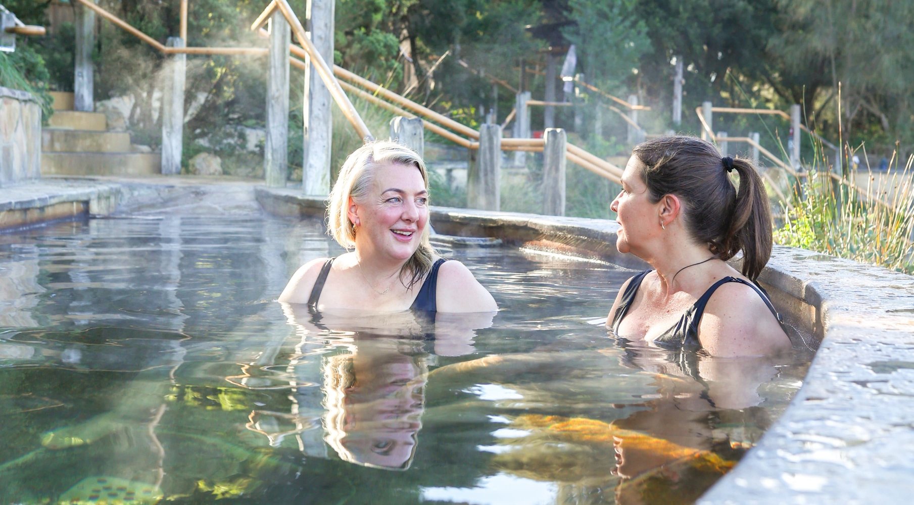 Two women bathing in hot springs