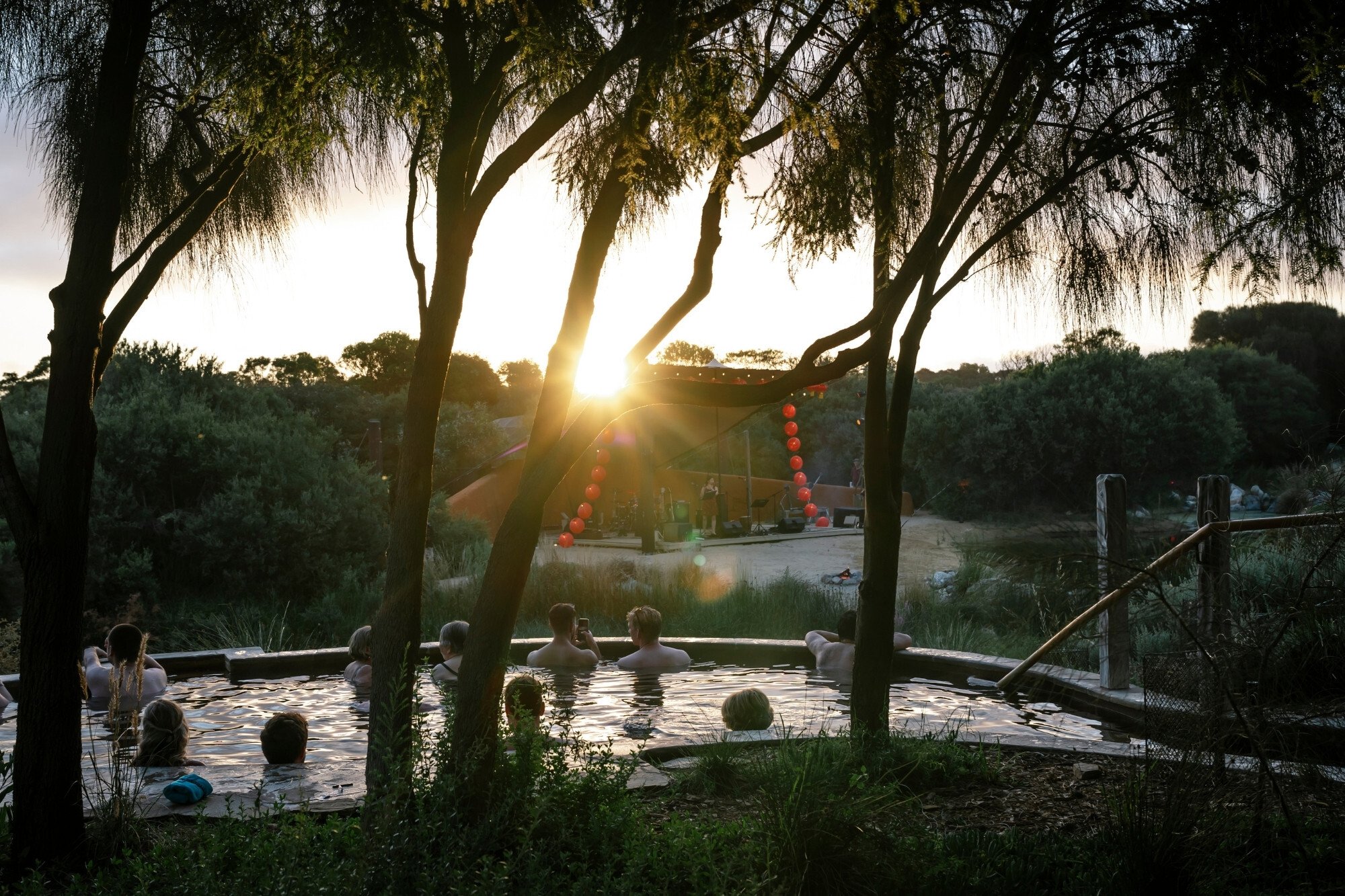 People bathing and watching the Amphitheatre stage