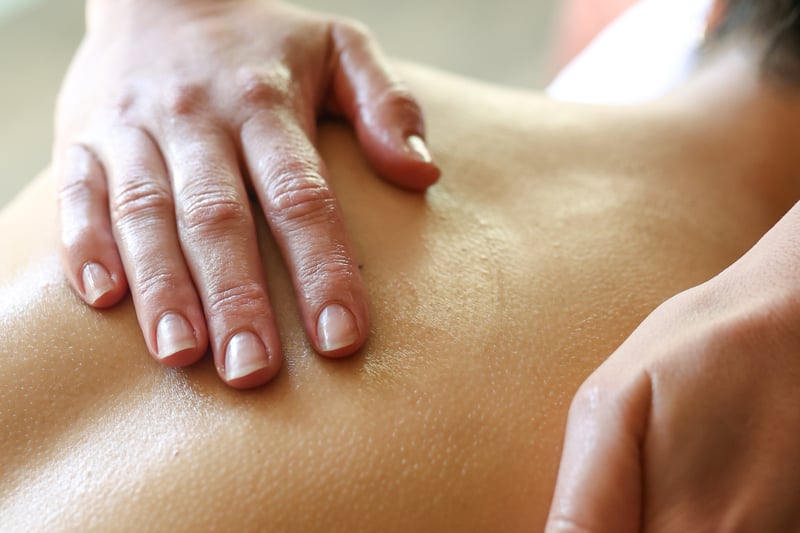 A person receiving a back massage