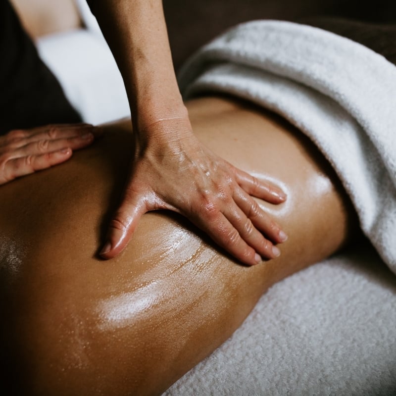 A woman receiving a back massage