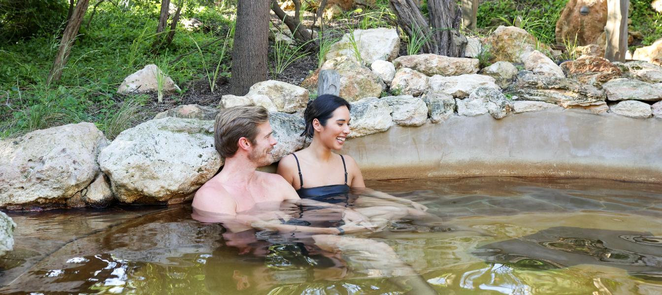 A couple bathing in hot springs