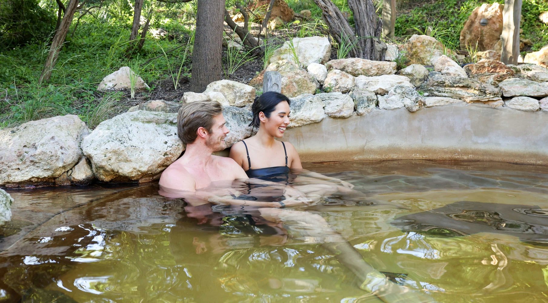 A couple bathing in hot springs