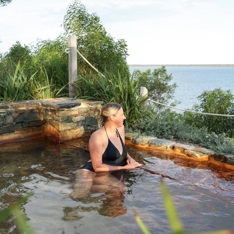 A woman bathing in a hot spring at Metung