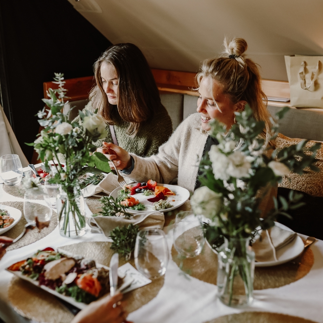 Two people enjoying lunch at a corporate event in the Moroccan Pavilion